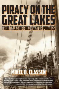 UPPAA A sepia-toned book cover titled "Piracy on the Great Lakes: True Tales of Freshwater Pirates" by Mikel B. Classen, featuring ship rigging and a quote praising the book at the bottom.
