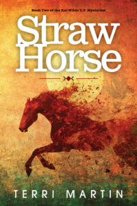 UPPAA A red silhouette of a running horse is set against a textured orange and yellow background with a large sun. The title “Straw Horse” appears in large white text above the horse. The author’s name, Terri Martin, is at the bottom.